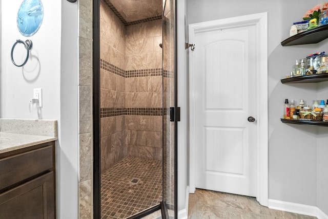1438 Millet Dr, Clarksville, TN 37040 - bathroom featuring a stall shower, vanity, and baseboards