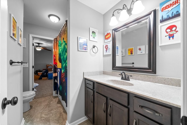 1438 Millet Dr, Clarksville, TN 37040 - bathroom featuring toilet, vanity, ceiling fan, baseboards, and a shower with shower curtain