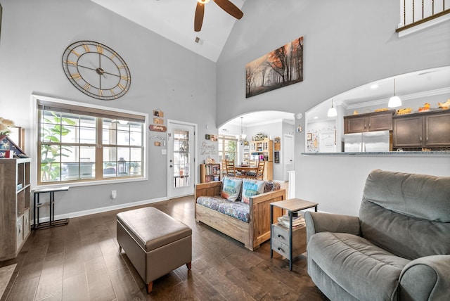 1438 Millet Dr, Clarksville, TN 37040 - living room with a ceiling fan, arched walkways, dark wood finished floors, healthy amount of natural light, and high vaulted ceiling