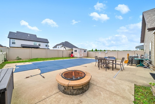 1438 Millet Dr, Clarksville, TN 37040 - view of swimming pool featuring a fire pit, a patio, a fenced backyard, and outdoor dining space