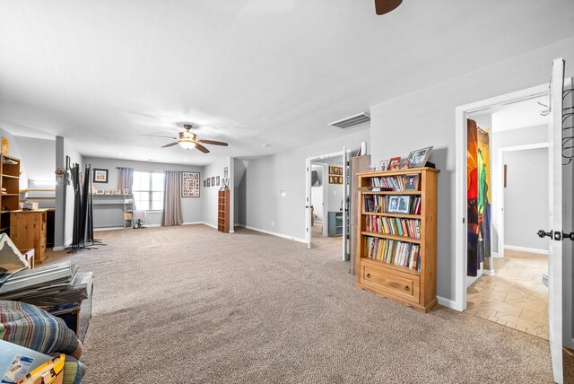 1438 Millet Dr, Clarksville, TN 37040 - living room featuring a ceiling fan, light carpet, and baseboards