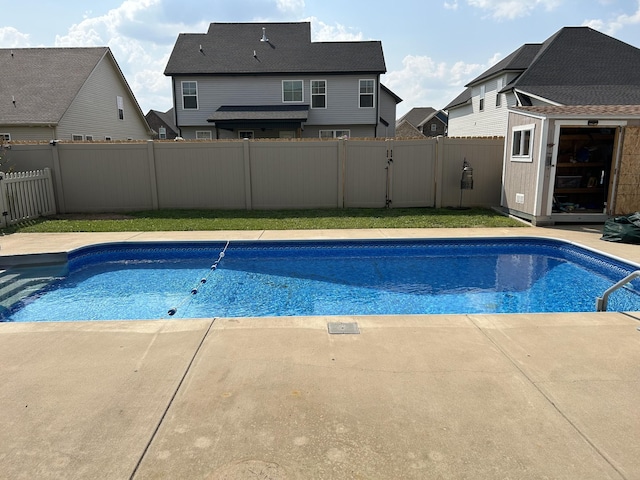 1438 Millet Dr, Clarksville, TN 37040 - view of swimming pool featuring a fenced backyard, an outdoor structure, and a patio area