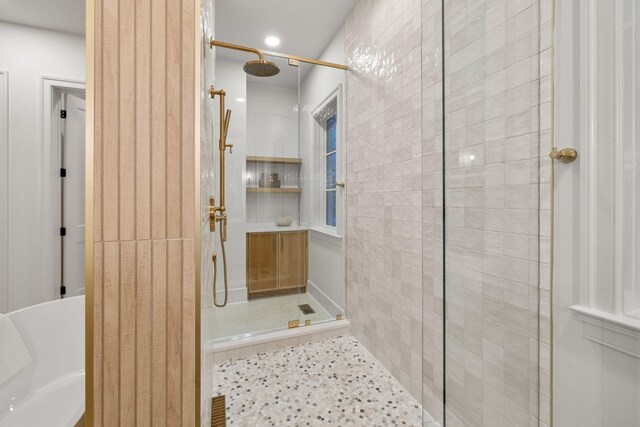 full bathroom with tiled shower