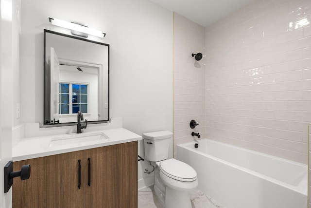 bathroom with toilet, vanity, and shower / tub combination