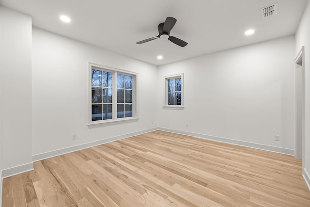 unfurnished room featuring recessed lighting, visible vents, a ceiling fan, light wood-type flooring, and baseboards