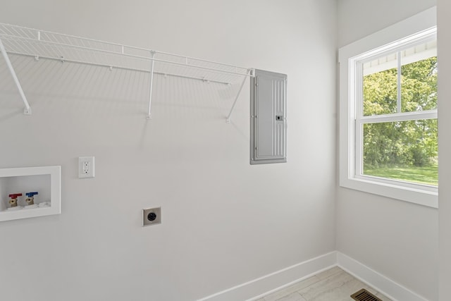 laundry room with laundry area, electric panel, hookup for a washing machine, baseboards, and electric dryer hookup