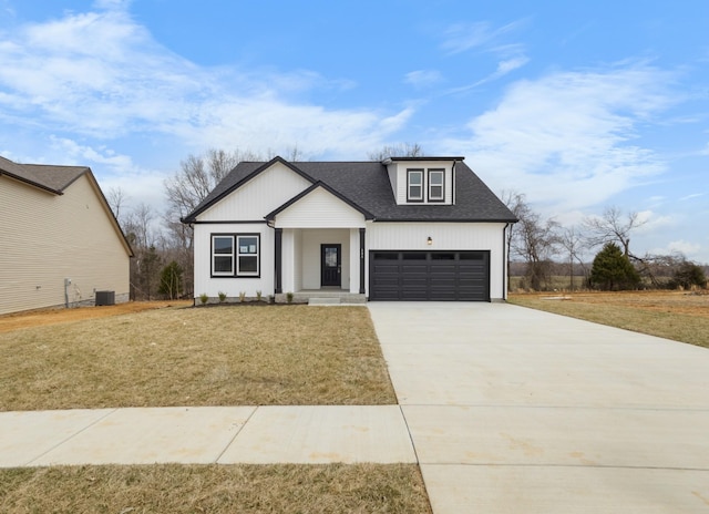 484 Herman Dr, Clarksville, TN 37042 - modern farmhouse style home with central AC, a front lawn, driveway, and roof with shingles