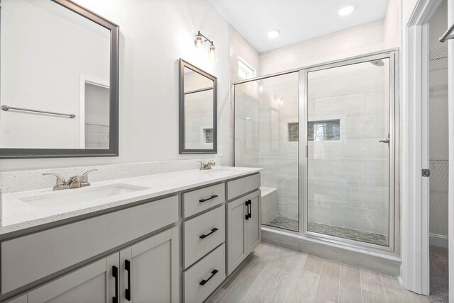 484 Herman Dr, Clarksville, TN 37042 - full bath featuring double vanity, a spacious closet, a stall shower, and a sink