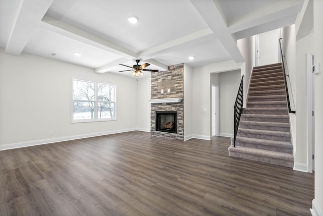 484 Herman Dr, Clarksville, TN 37042 - unfurnished living room featuring a ceiling fan, beamed ceiling, a fireplace, stairs, and dark wood-style flooring