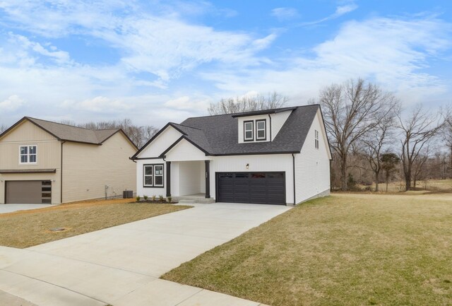 484 Herman Dr, Clarksville, TN 37042 - modern inspired farmhouse with a shingled roof, driveway, and a front lawn