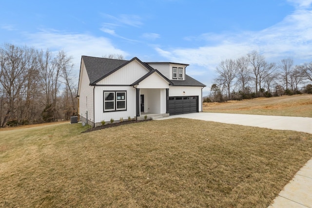 484 Herman Dr, Clarksville, TN 37042 - modern farmhouse with driveway, central AC, a front yard, and a shingled roof