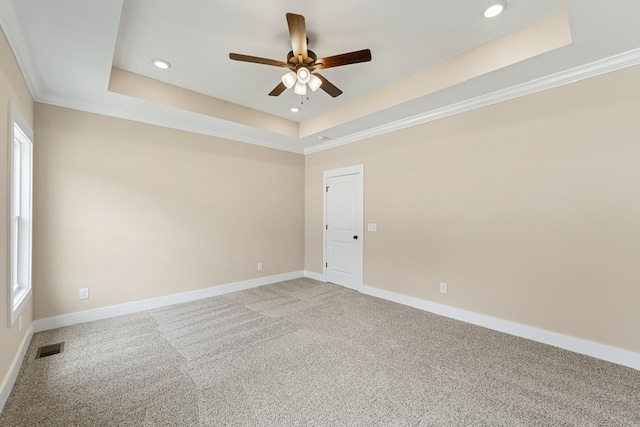 unfurnished room with a ceiling fan, a raised ceiling, light colored carpet, baseboards, and recessed lighting