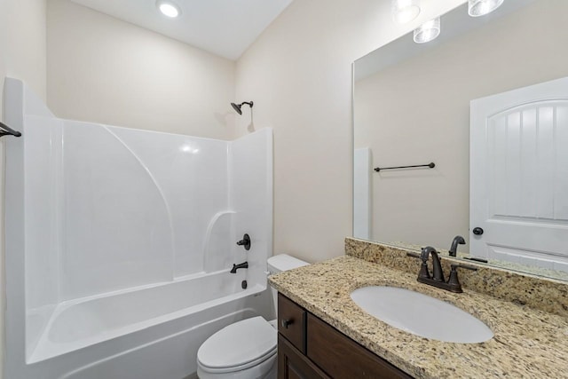 full bath featuring washtub / shower combination, toilet, and vanity