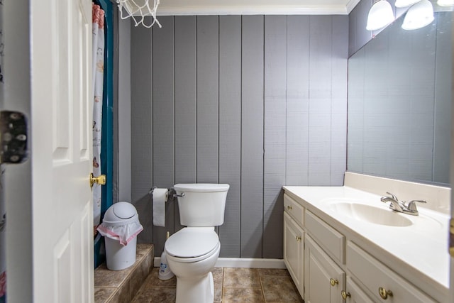 full bathroom with toilet and vanity
