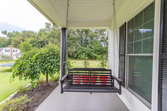 view of patio with covered porch and a trampoline