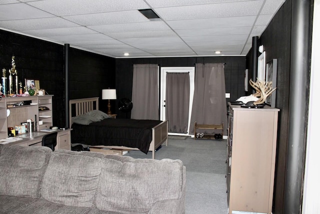 bedroom featuring a paneled ceiling and carpet