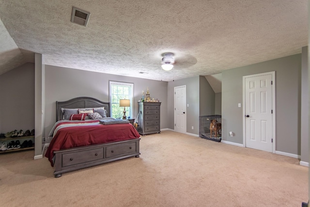 carpeted bedroom featuring baseboards, visible vents, a textured ceiling, and ceiling fan