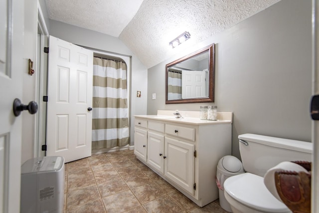 full bath with vaulted ceiling, toilet, vanity, a shower with shower curtain, and a textured ceiling