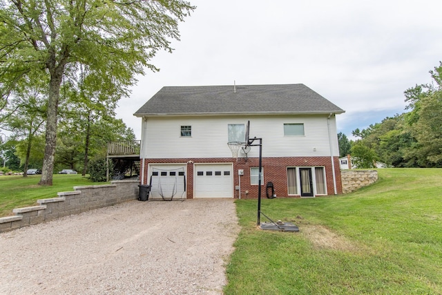 back of property featuring brick siding, a garage, a deck, a yard, and dirt driveway