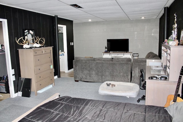 interior space featuring concrete block wall and walk in shower