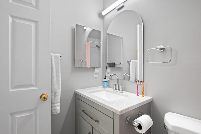 full bath with vanity and toilet