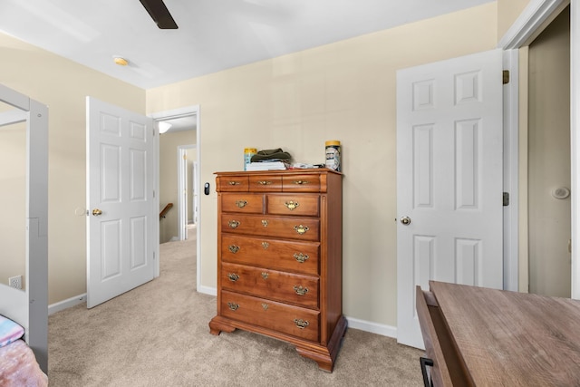 bedroom with light carpet, baseboards, and ceiling fan