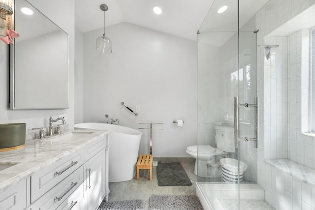 bathroom with a stall shower, vanity, a soaking tub, toilet, and recessed lighting