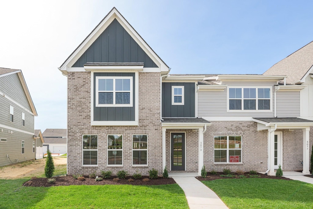 5073 Greentree, Smyrna, TN 37167 - view of front of property featuring brick siding, board and batten siding, and a front yard