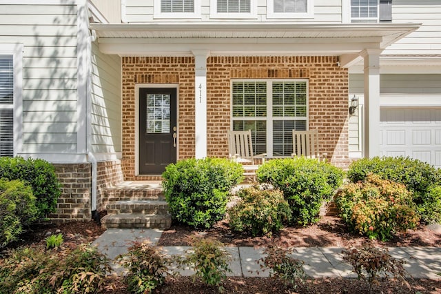 411 Valleyview Dr, Franklin, TN 37064 - view of exterior entry with brick siding and a porch