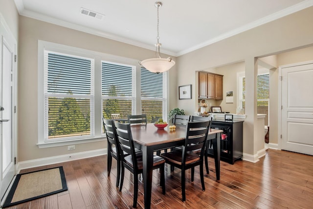 411 Valleyview Dr, Franklin, TN 37064 - dining room with hardwood / wood-style floors, visible vents, a wealth of natural light, and crown molding