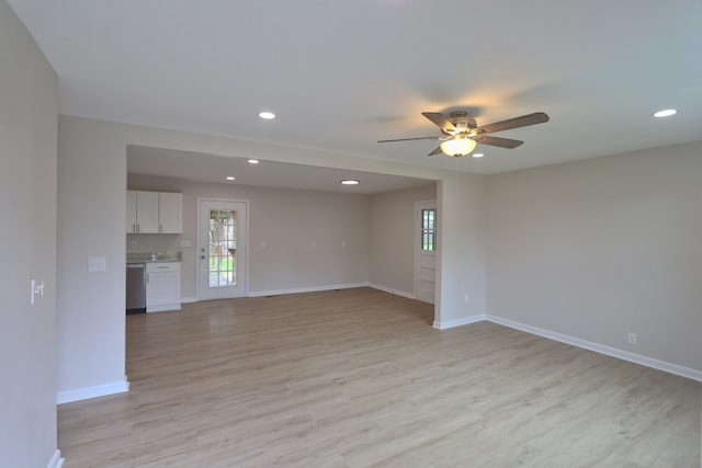 unfurnished room featuring light wood-style floors, ceiling fan, recessed lighting, and baseboards