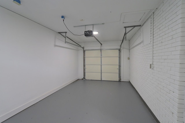garage with a garage door opener and baseboards