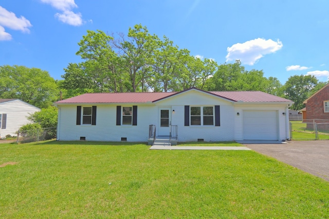ranch-style house with fence, aphalt driveway, metal roof, a garage, and a front lawn