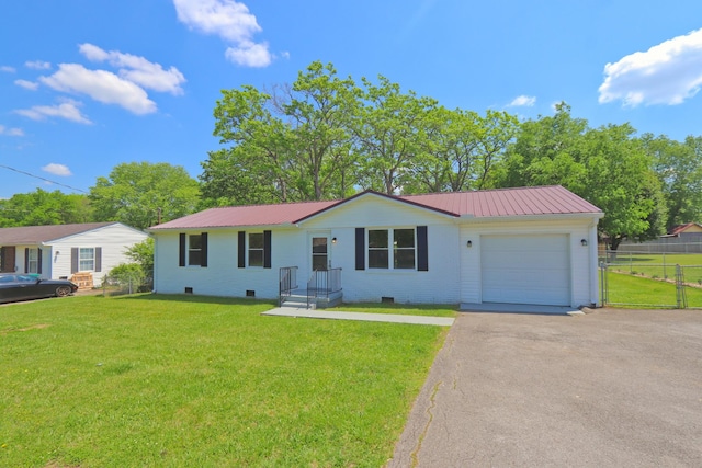 ranch-style home with a front lawn, a garage, metal roof, driveway, and fence