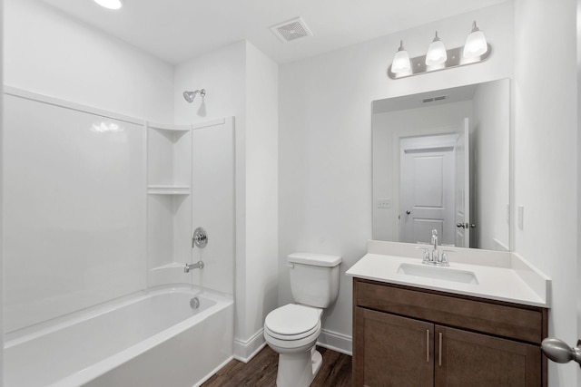 full bath with wood finished floors, vanity, toilet, shower / bathtub combination, and visible vents