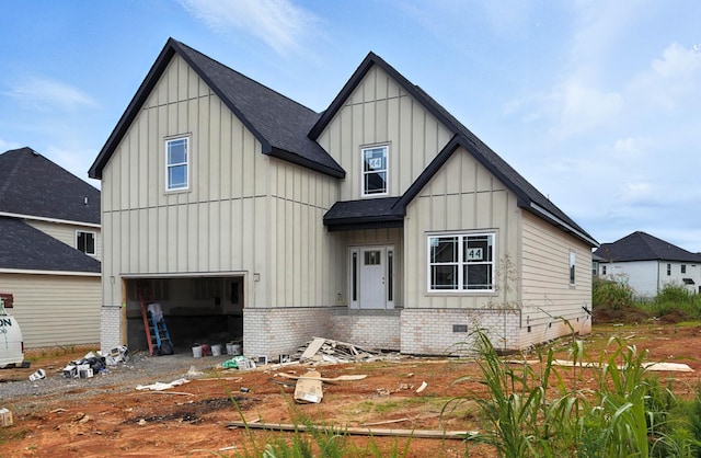 994 Alton Dr, Clarksville, TN 37043 - view of front of home with board and batten siding, an attached garage, and roof with shingles