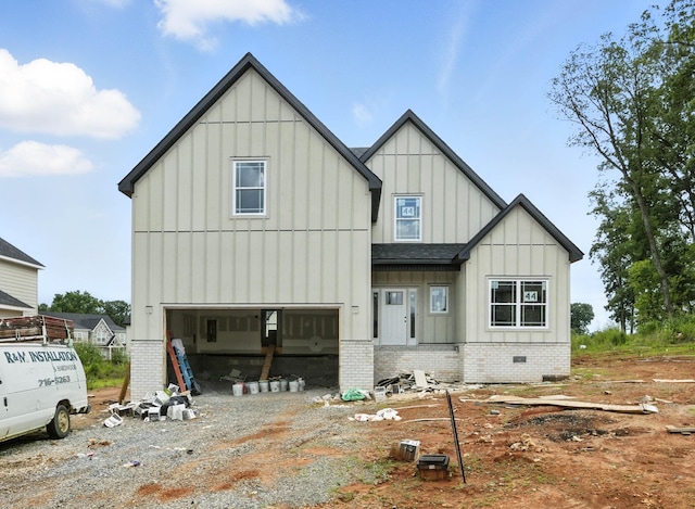 994 Alton Dr, Clarksville, TN 37043 - view of front facade featuring board and batten siding, a garage, driveway, roof with shingles, and crawl space