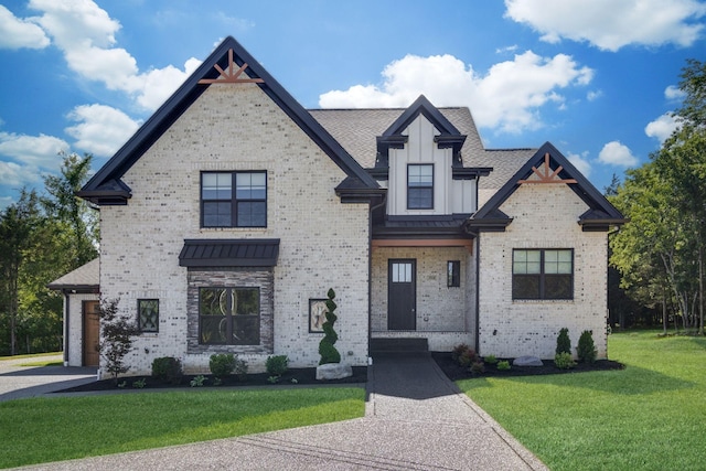 french provincial home featuring board and batten siding, a shingled roof, a front lawn, and brick siding