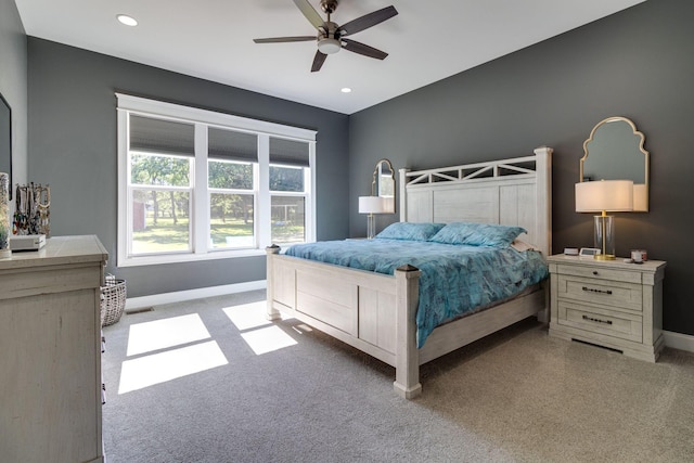 bedroom featuring recessed lighting, baseboards, ceiling fan, and light colored carpet