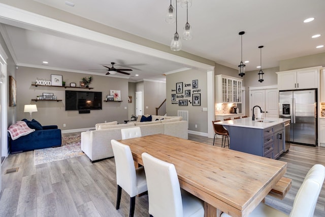 dining space with ceiling fan, baseboards, recessed lighting, and stairway
