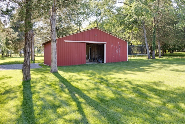 view of pole building with a yard