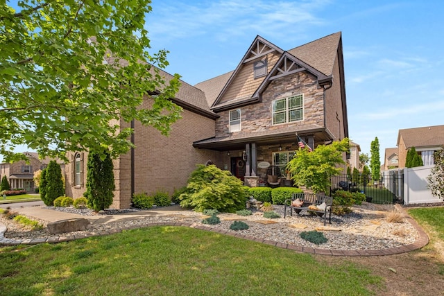 5000 Moretto Ct, Spring Hill, TN 37174 - view of front of home featuring fence, stone siding, and a front lawn