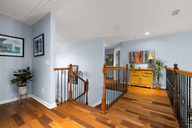 5000 Moretto Ct, Spring Hill, TN 37174 - hallway featuring visible vents, an upstairs landing, attic access, and hardwood / wood-style floors