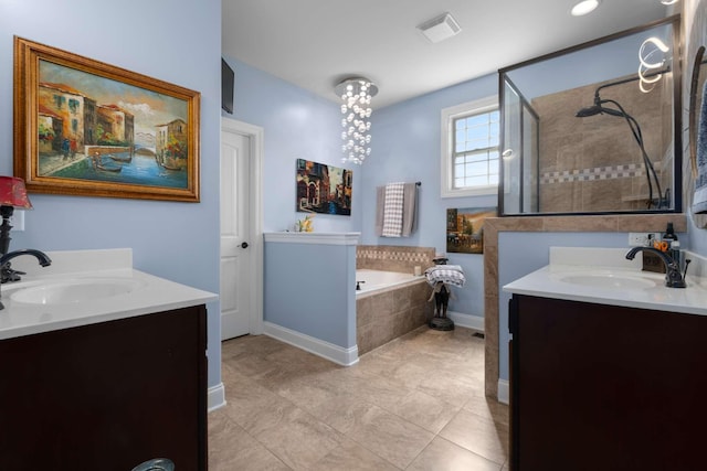 5000 Moretto Ct, Spring Hill, TN 37174 - bathroom featuring a garden tub, visible vents, vanity, baseboards, and tiled shower