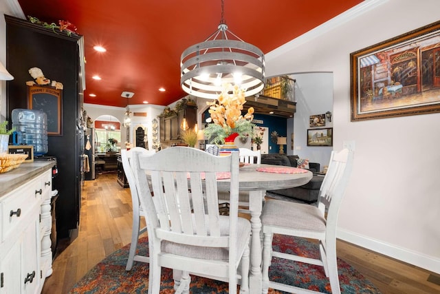 5000 Moretto Ct, Spring Hill, TN 37174 - dining area featuring crown molding, wood finished floors, baseboards, an inviting chandelier, and recessed lighting