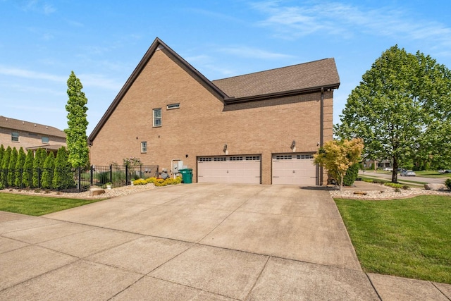 5000 Moretto Ct, Spring Hill, TN 37174 - view of property exterior with a garage, fence, brick siding, concrete driveway, and a yard