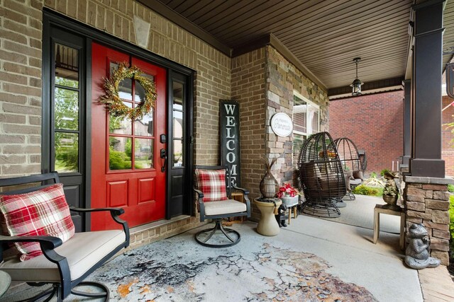 5000 Moretto Ct, Spring Hill, TN 37174 - entrance to property with a porch and brick siding