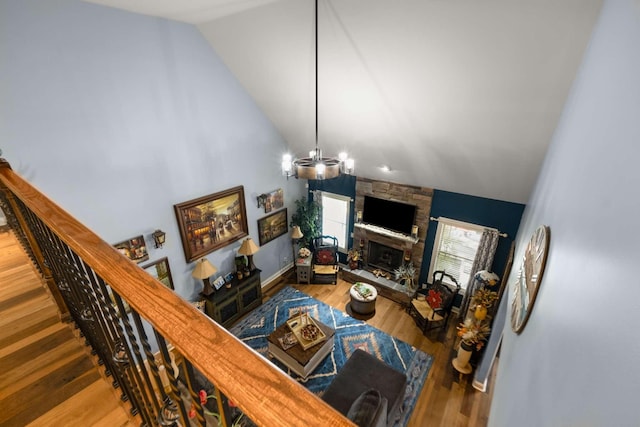 5000 Moretto Ct, Spring Hill, TN 37174 - living area with baseboards, a stone fireplace, wood finished floors, and high vaulted ceiling