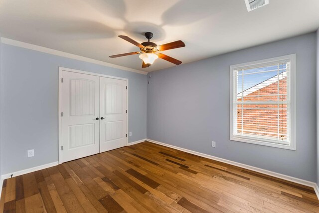 5000 Moretto Ct, Spring Hill, TN 37174 - unfurnished bedroom with wood finished floors, a closet, and ceiling fan