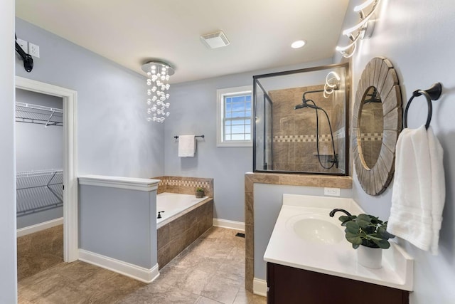 5000 Moretto Ct, Spring Hill, TN 37174 - full bathroom with a garden tub, vanity, a tile shower, and a walk in closet